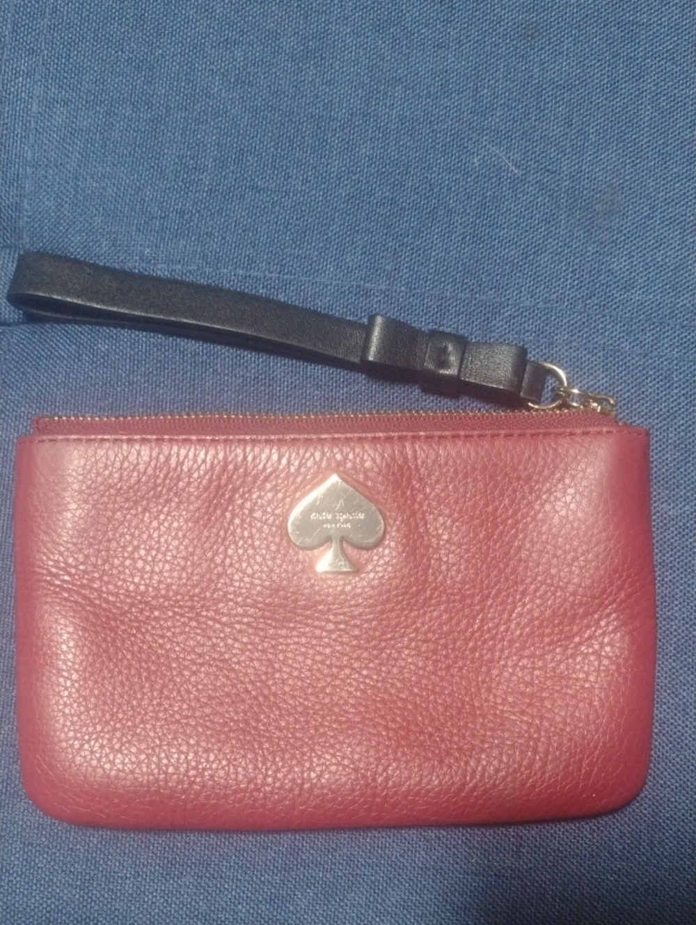 kate spade rose red pebbled leather wristlet with black strap